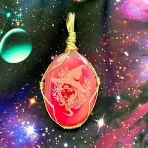 A gorgeous agate crystal wrapped pendant with a quirky witch on it